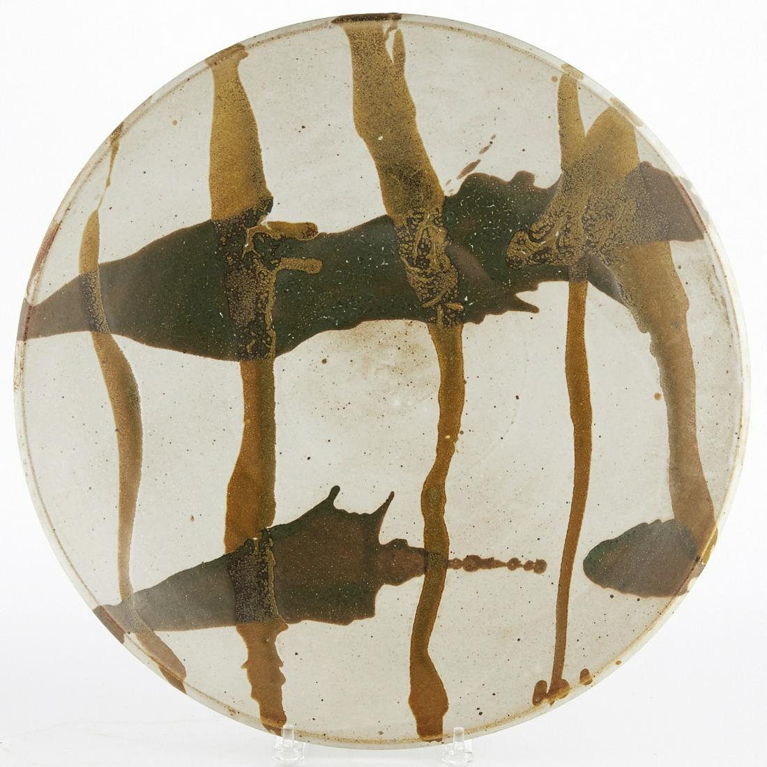 Warren MacKenzie Studio Pottery Platter Marked: Warren MacKenzie (1928-2018). Studio pottery ceramic platter. Drip-glazed stoneware. Marked along the footrim. Warren MacKenzie was a renowned Minnesota studio potter. A student of Bernard Leach and S