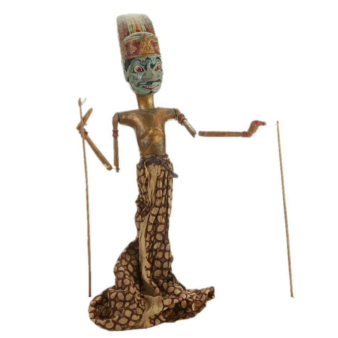 Indonesian Javanese Golek Puppet: One Indonesian (Javanese) Golek puppet of a human or a god. Polychrome wood head and torso with jointed arms and a cloth costume. Keywords: Wayang golek Asia Height: 25 in x width: 6 in x depth: 8 in.
