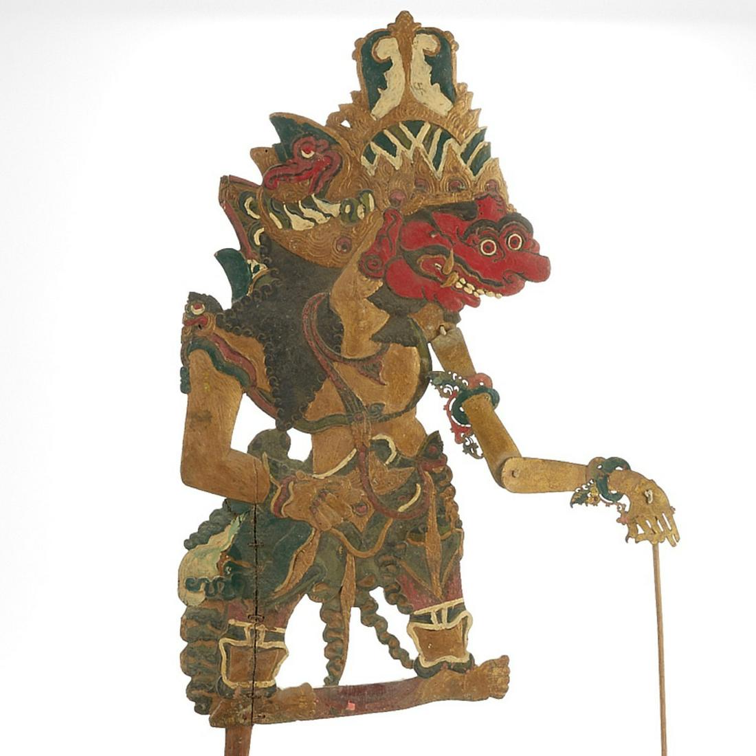 Indonesian (Balinese) Shadow Puppet of Humans and Gods: Indonesian (Balinese) shadow puppet depicting a figure of a human or a god. Polychrome leather with articulated joints and wooden control rods. Keyword: Wayang kulit Asia Height: 31 1/4 in x width: 11