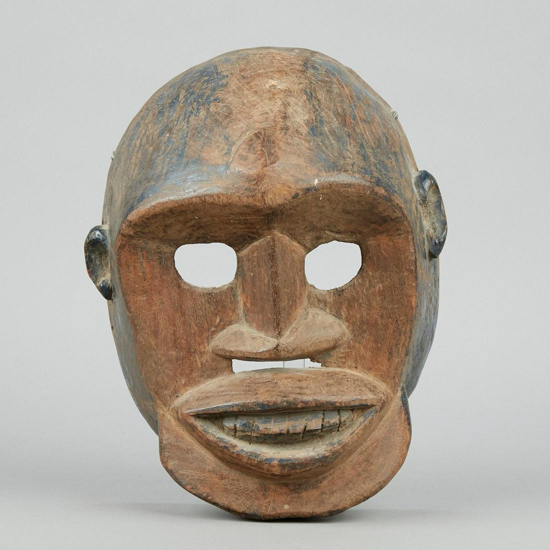 West African Wood Mask Nigeria: West African carved wood mask possibly from Nigeria. Well carved with remnants of polychrome decoration. Height: 13 in x width: 10 in x depth: 7 in.