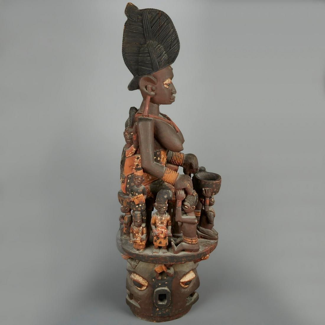 Massive African Yoruba Epa Helmet Mask: Yoruba Epa helmet mask Nigeria. The Janus faced helmet mask is surmounted by a highly detailed figural superstructure with a large central female figure with an elaborate hairstyle surrounded by small