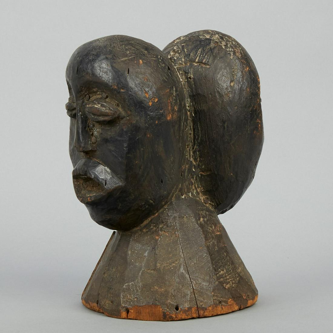 Ekoi or Ijo African Double Headed Bust: Ekoi (Ejagham) or Ijo (Ijaw) double headed carved wood bust Nigeria. Double headed or Janus figures are a common motif in Ekoi and Ijo art. Height: 10 in x width: 6 in x depth: 7 in.