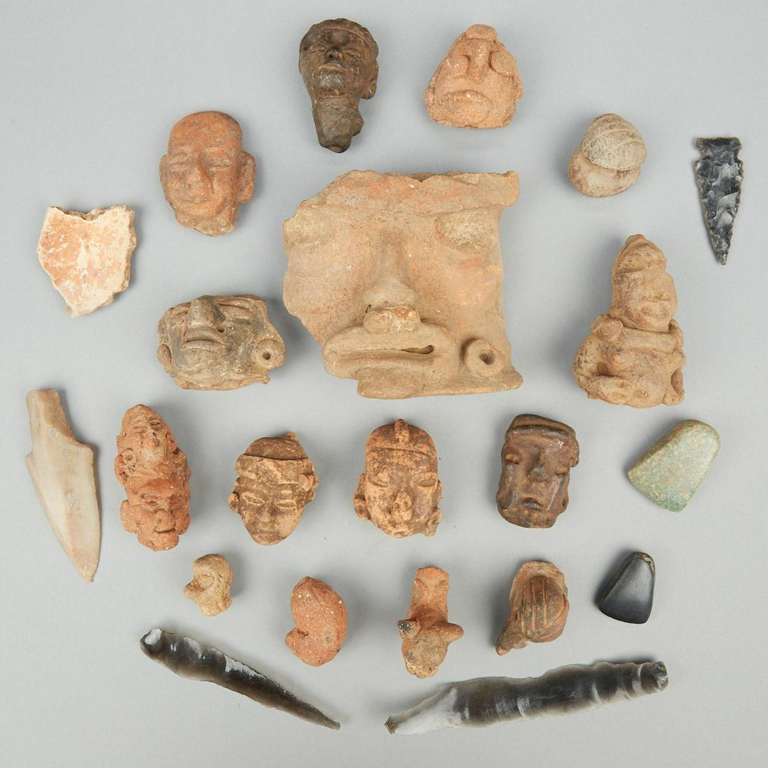Grp: Pre-Colombian Pieces Pottery Arrowheads: Group of pre-Columbian artifacts. Includes fourteen small ceramic heads and figures likely Mesoamerican; three obsidian arrowheads with one other stone arrowhead; two stone axes; and one pottery fragm