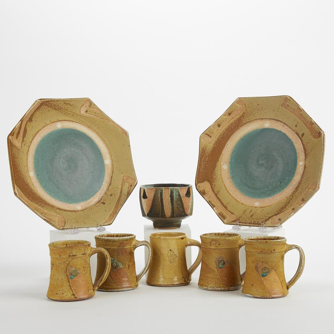 Grp: 8 Jeff Oestreich Studio Pottery Ceramic Dishes: Jeff Oestreich (b. 1947). Group of eight studio pottery ceramic dishes, comprised of five handled mugs, two plates, and one small bowl. All are marked along the footrim. (Plates) Height: 1 3/4 in x di