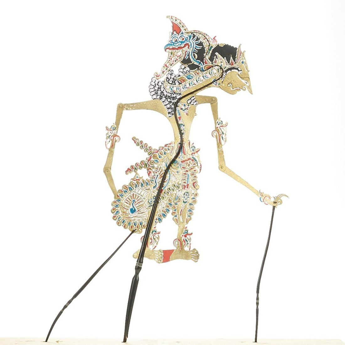 Indonesian (Balinese) Shadow Puppet of Humans and Gods: Indonesian (Balinese) shadow puppet depicting a figure of a human or a god. Polychrome leather with articulated joints and wooden control rods. Keyword: Wayang kulit, Asia Height: 27 in x width: 8 1/2