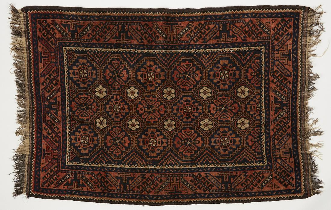 Baluch Wool Rug ca. 1910-1920: Baluch (Baluchi, Beluchi) wool rug or carpet, ca. 1910-1920. Lovely detailed woven design with rosettes in red, black, blue, and cream. Keywords: Persian rug, Oriental rug, Caucasian rug Length (inclu