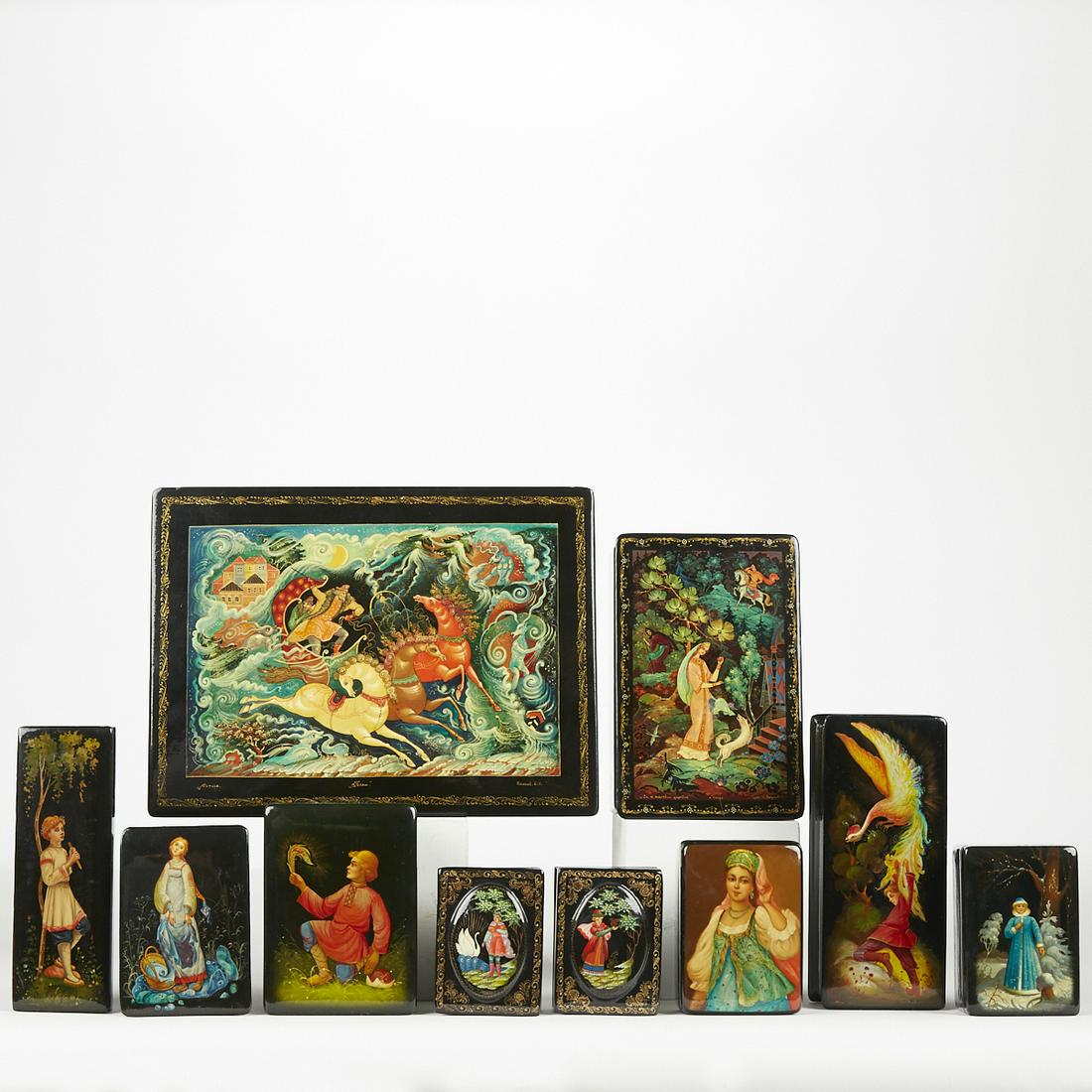 Group of 10 Russian Lacquer Boxes: Group of ten Russian lacquer boxes, beautifully illustrated with scenes from Russian folklore and fairy tales, including the Firebird. Height ranges from 1 in to 2 in; width ranges from 3 in to 10 in;