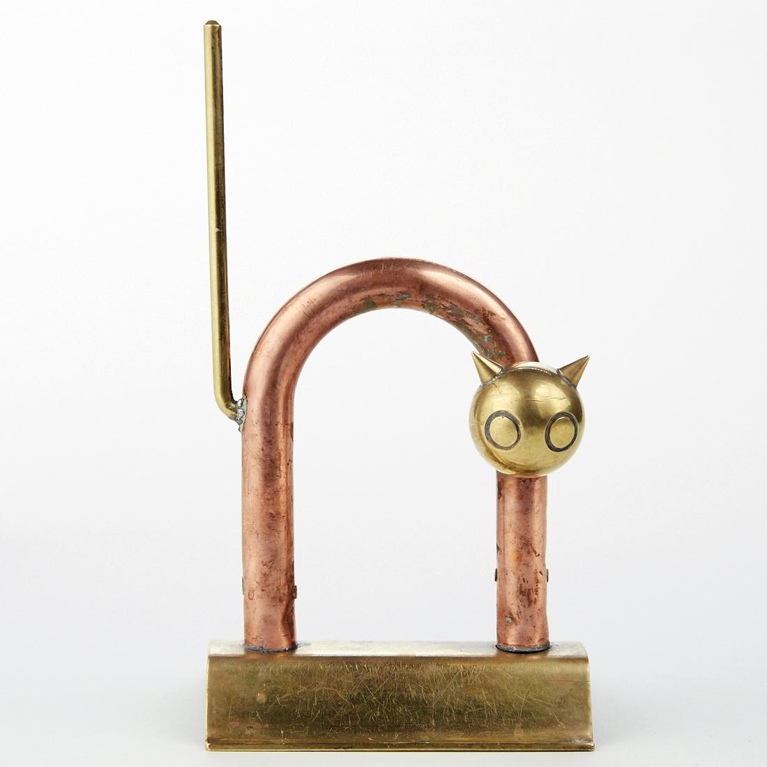 Walter von Nessen Chase Co. Brass & Copper Cat Doorstop: Walter von Nessen (1889-1943) for Chase Co., USA. Brass and copper cat doorstop made up of bold, geometric forms. Marked with Chase's centaur mark along the underside. Height: 8 1/2 in x width: 4 1/2 