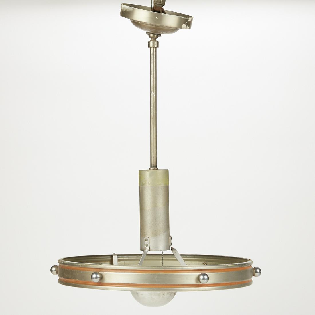 Art Deco Aluminum Ceiling Fixture: Art Deco aluminum ceiling light fixture with a striking round design and orange accents. A label adhered to the fixture reads "Underwriters Electric Fixture, 22440." Height: 23 in x width: 1