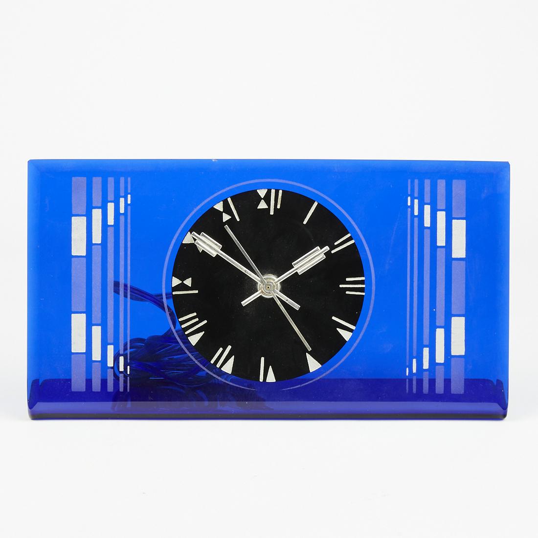 Waltham Co. Art Deco Blue Glass Electric Clock: Waltham Co., Massachusetts, USA. Art Deco clock featuring cobalt blue glass and striking geometric decoration. Waltham label adhered to the verso. Clock functions. Similar to clocks by Crystal Bent Fy