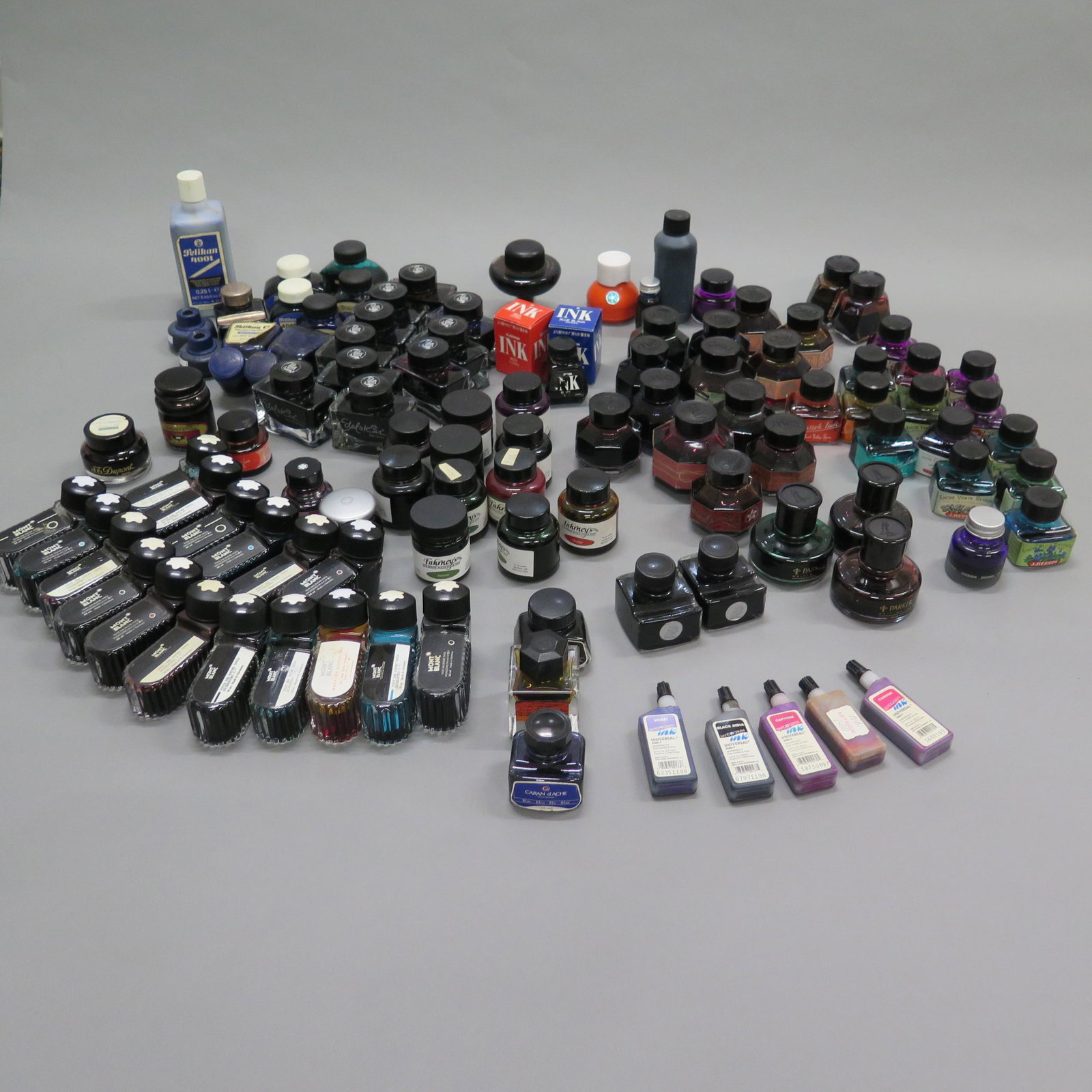 Lrg Grp of 121 Fountain Pen Inks: Large group of 121 inks. Includes nineteen Montblanc inks, all opened, including three limited edition inks: Mahatma Gandhi, Je T'aime Love Letter Ink, and Season's Greetings Scented Ink. Twenty one P