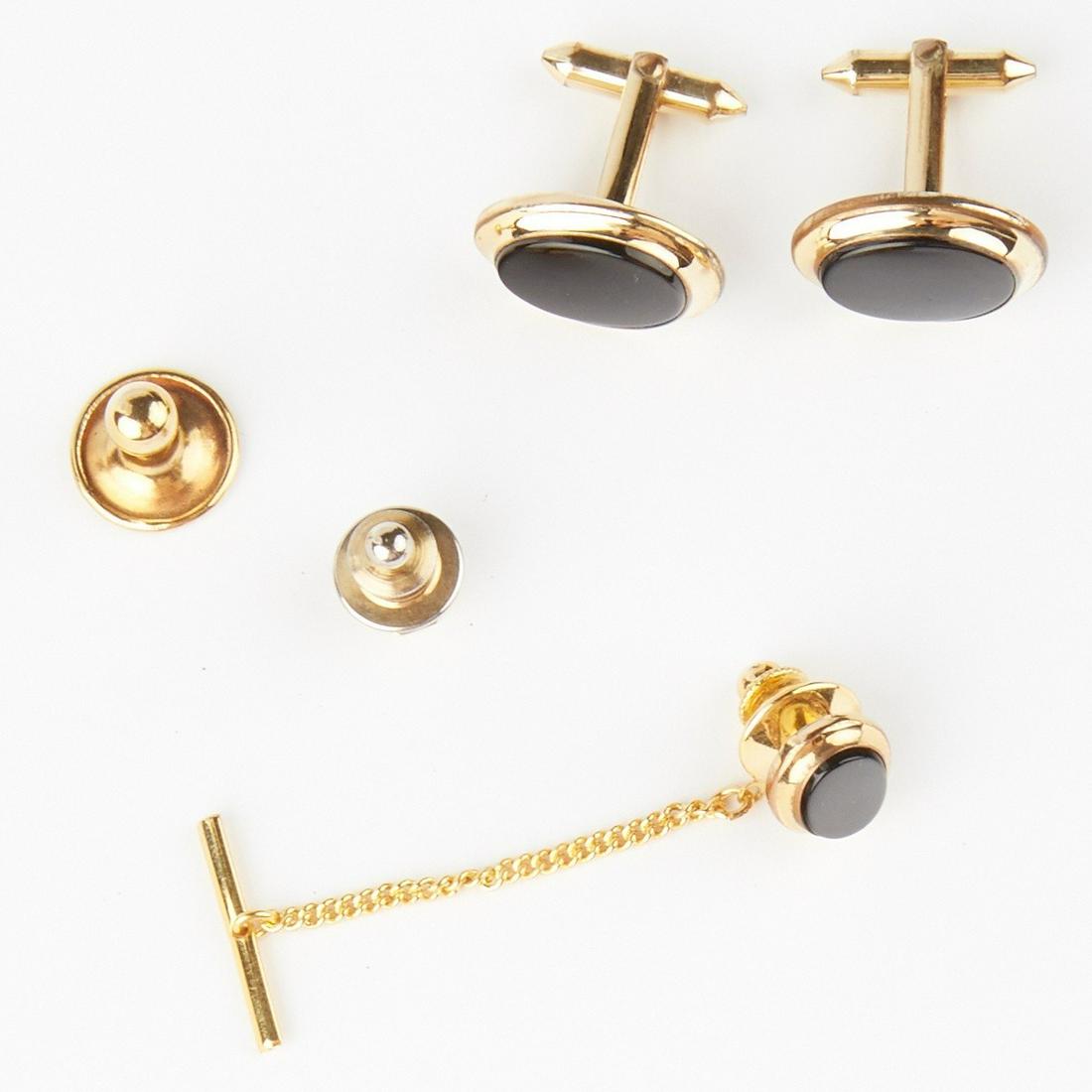 Grp: Cufflinks Stud Tie Pin: Group of men's jewelry. Includes one pair of oval 14K gold and onyx cufflinks with coordinating tie pin, one textured octagonal 14K gold stud, and one fixed backing cufflink.