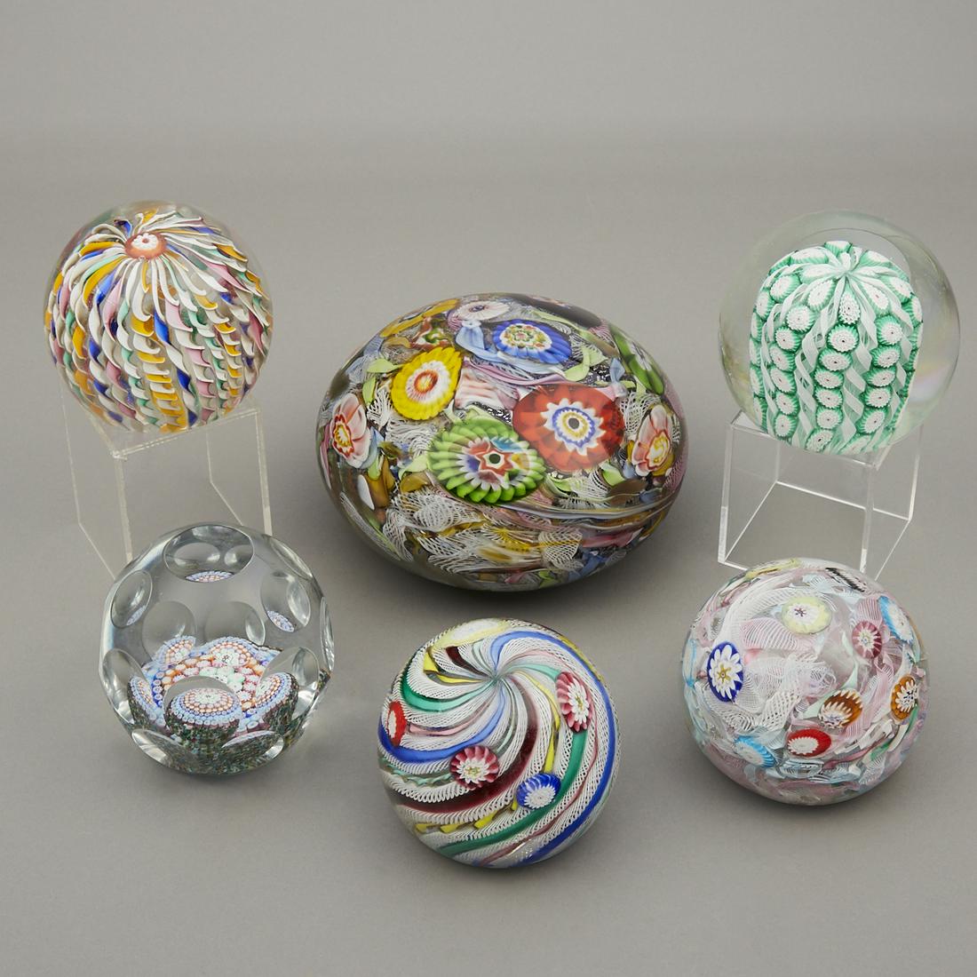 Group of 6 Large Murano Glass Millefiori Paperweights: Group of six large and colorful Murano glass millefiori paperweights. These lovely weights are excellent examples of Italian glass blowing.Height ranges from 3 in to 4 1/2 in; diameter ranges from 4 i