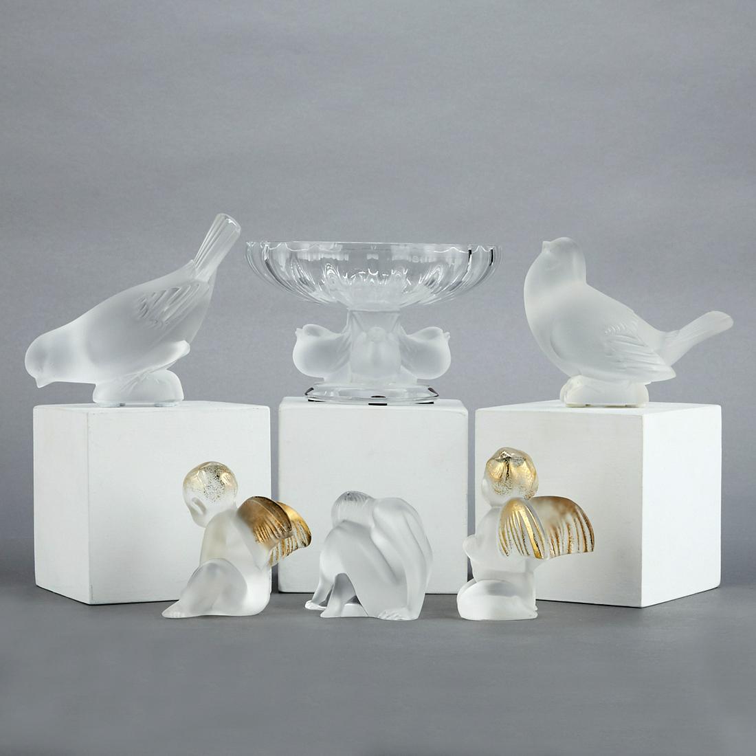 Grp: 6 Lalique Glass Crystal Figures: Lalique, France. Group of six glass crystal figures comprised of two cherubs with gilt hair and wings, two frosted birds, one seated nude figure, and one compote decorated with birds along its base. C