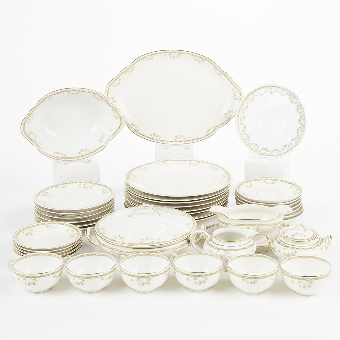 Theodore Haviland China Porcelain Dinner Service Set: Set of Theodore Haviland porcelain China dinnerware. Set includes one salad bowl, one serving platter, one covered vegetable bowl, one bread & butter plate, one gravy boat with attached underplate, on