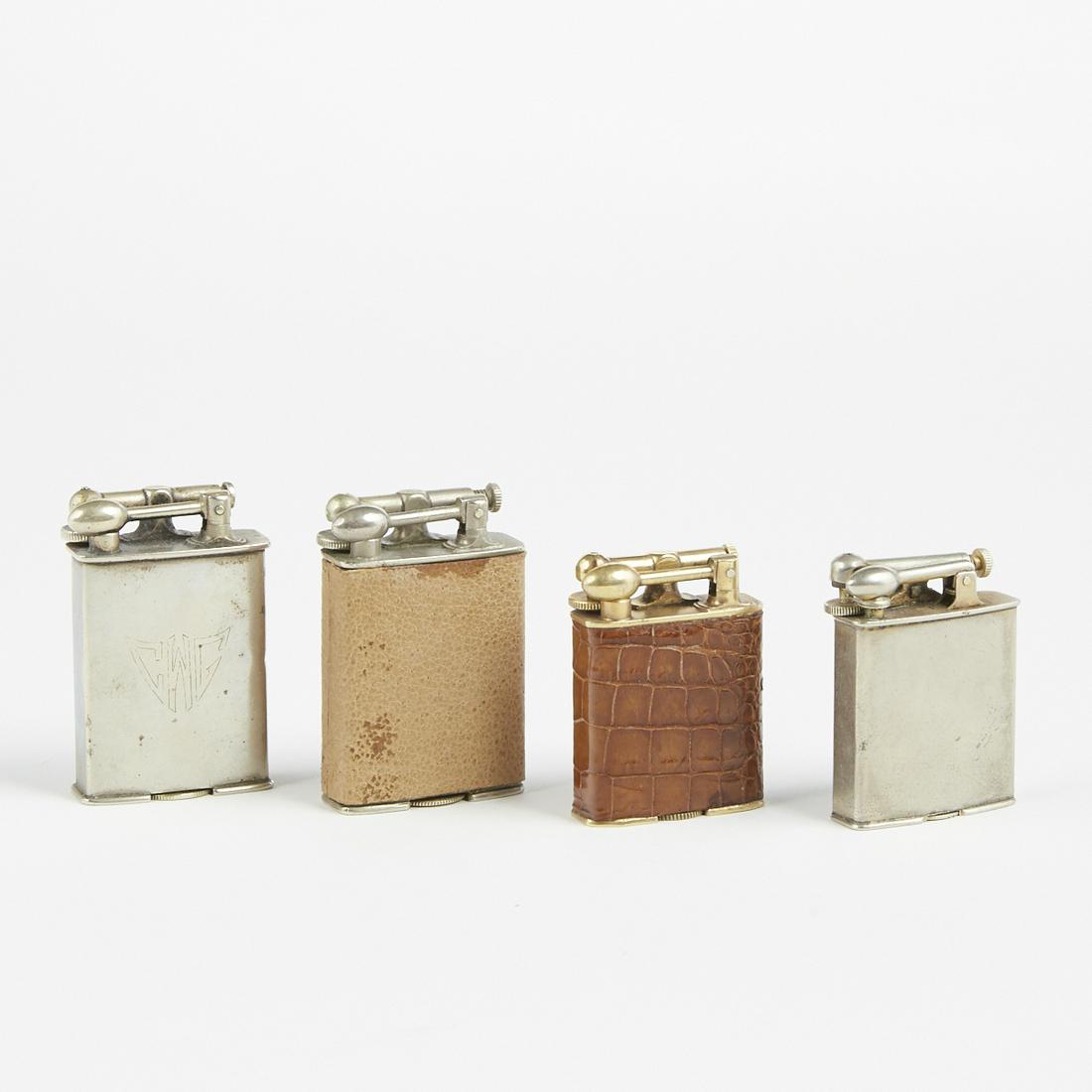 Grp: 4 Clark Swing Arm Lighters Firefly: Clark, United States. Group of four lighters. Two early 20th century platinum electro plated swing arm lighters, impressed logo Clark along the underlays. One early 20th century 18 karat gold electro