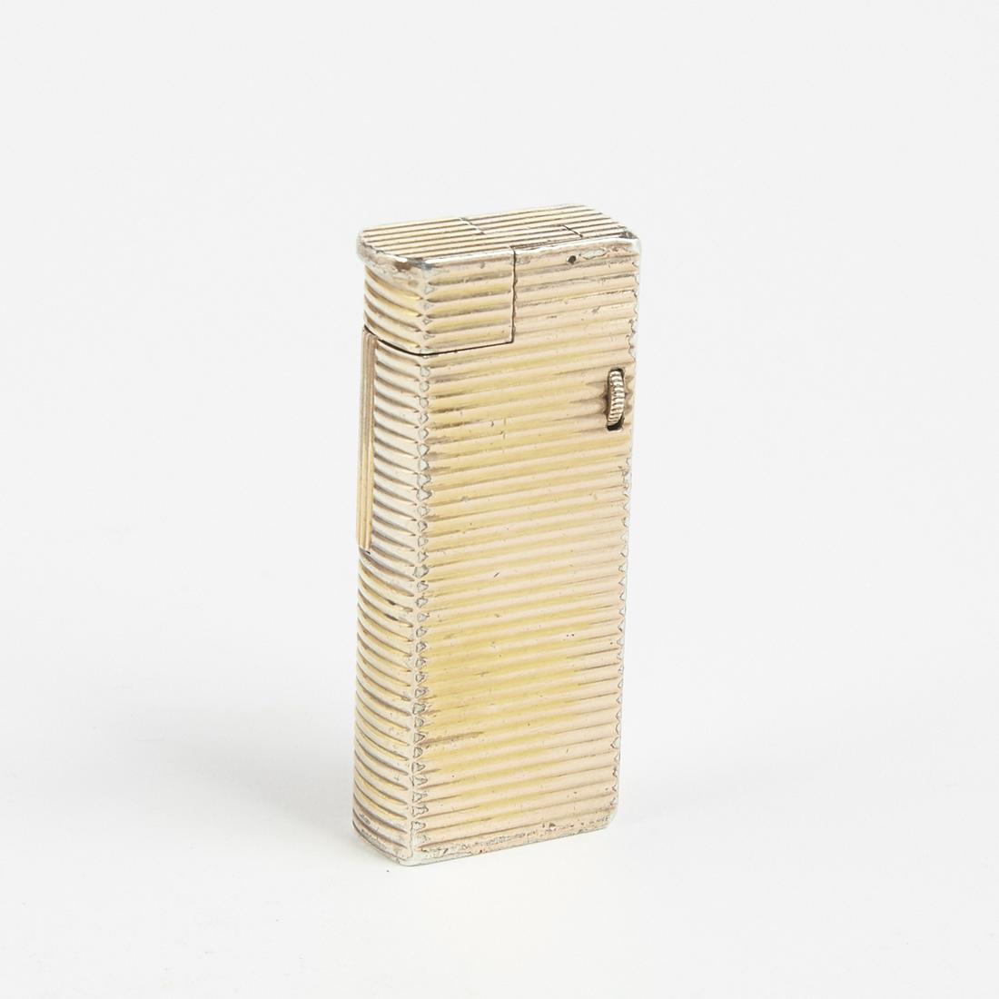 Dunhill Gold Filled Broadboy Lighter on Sterling: Dunhill, United Kingdom. One mid-century Gold Filled Broadboy Lighter. Impressed logo "Dunhill" along the bottom. Impressed "FLG GS GALV" along underlay. Patent # 132-84.