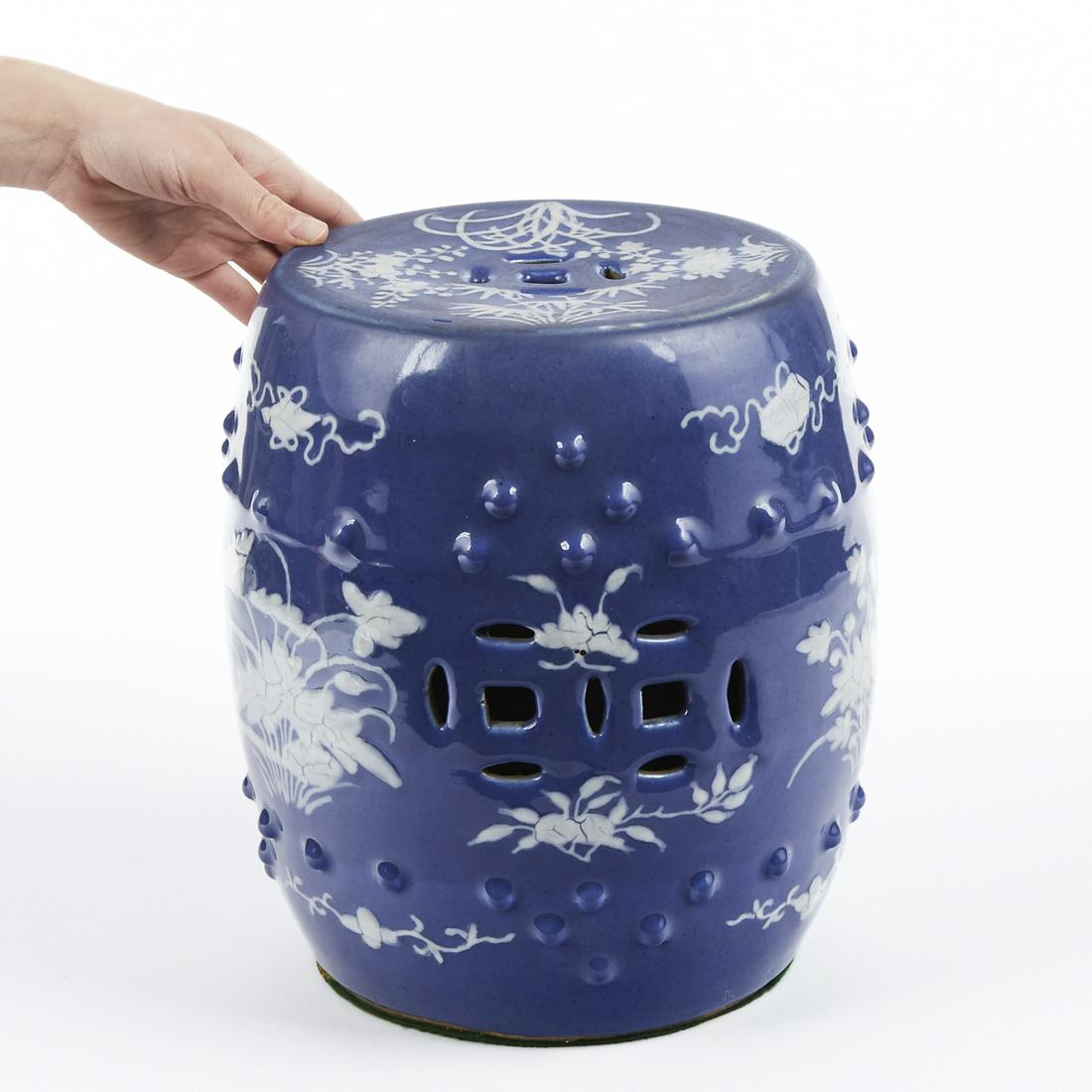 19th c. Chinese Porcelain Child's Garden Seat Barrel: 19th century Chinese porcelain child's garden seat in barrel form with hobnail-like knobs and pierced sides. White slip cup floral decoration on a blue slip ground. Height: 12 1/2 in x diameter: 9 in.