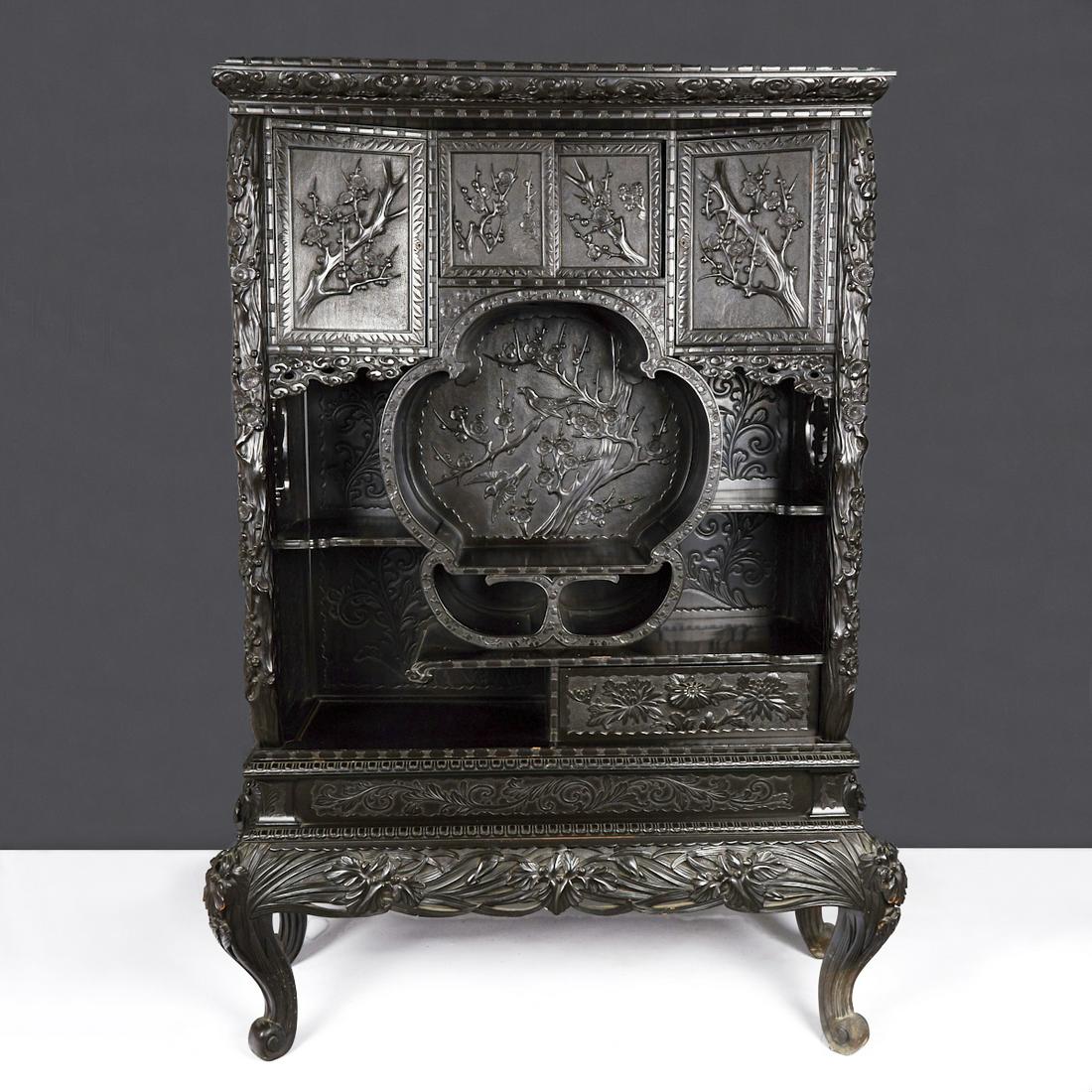 Japanese Export Curio Shodhana Cabinet: A large and impressive Japanese export curio cabinet shodhana with elaborate carving and details. A very fine example of Japanese export carving during the Meiji era. Height: 74 1/2 in x width: 46 in 