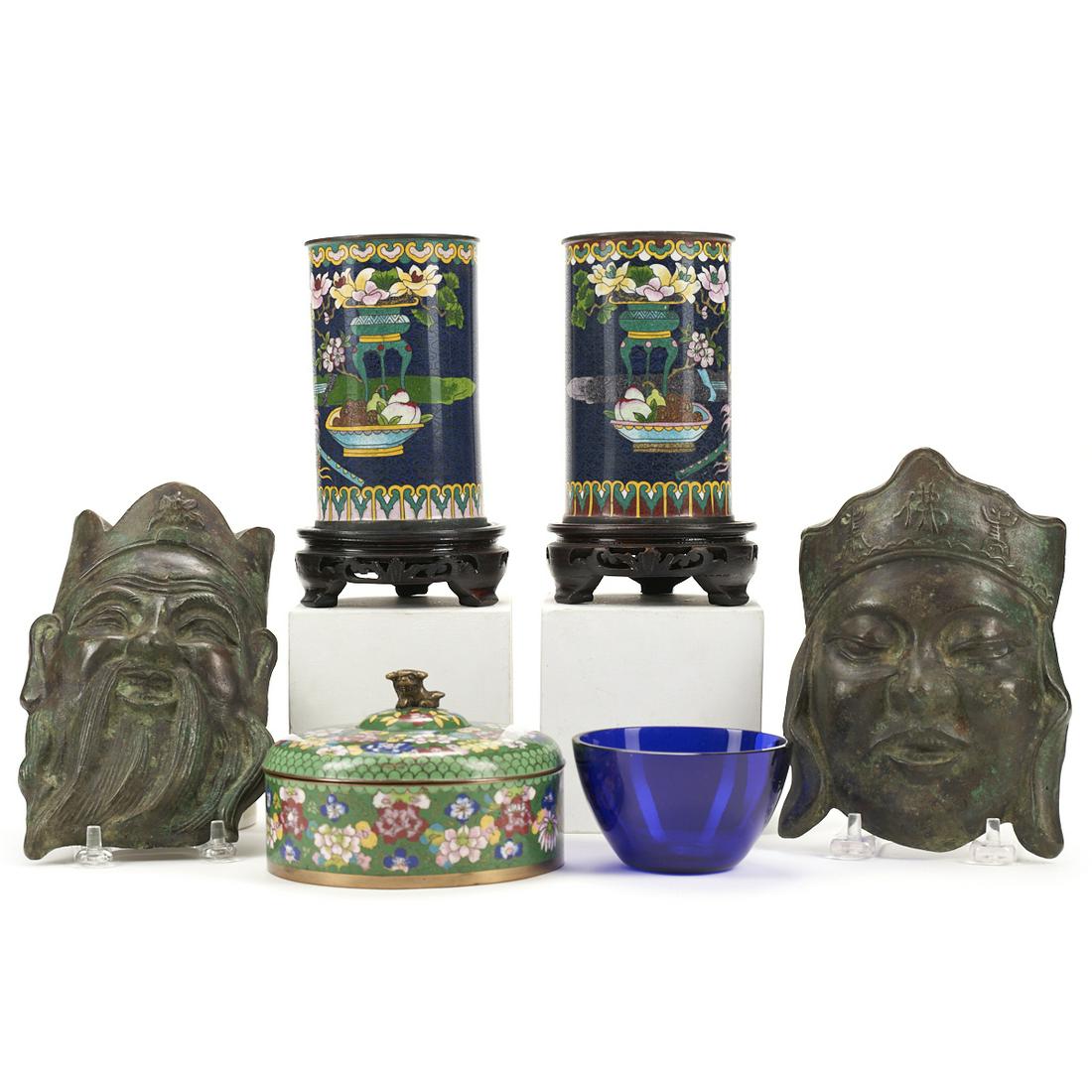 Grp: 6 Chinese Objects - Cloisonne Bronze: A lovely group of Chinese antiques including two cloisonne brush holders, two bronze face plaques, one cloissone lidded dish, and a small blue bowl.Height ranges from 1 1/2 in to 7 in; width ranges fr