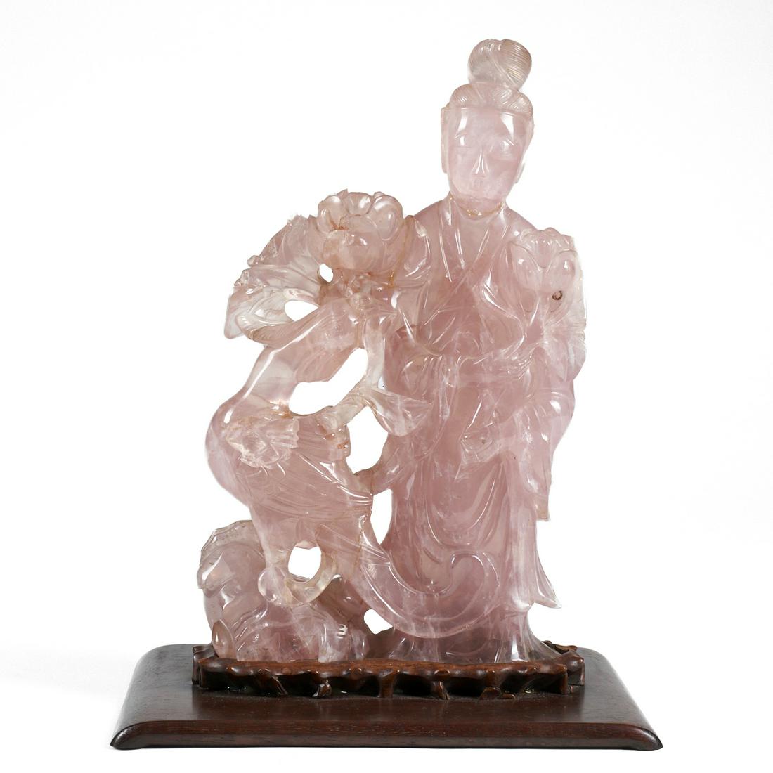 Antique Chinese Rose Quartz Woman & Bird Sculpture: Chinese rose quartz sculpture of a woman and bird on a carved wooden stand affixed to a wooden base. With stand; height: 11 1/2 in x width: 8 3/4 in x depth: 6 in.