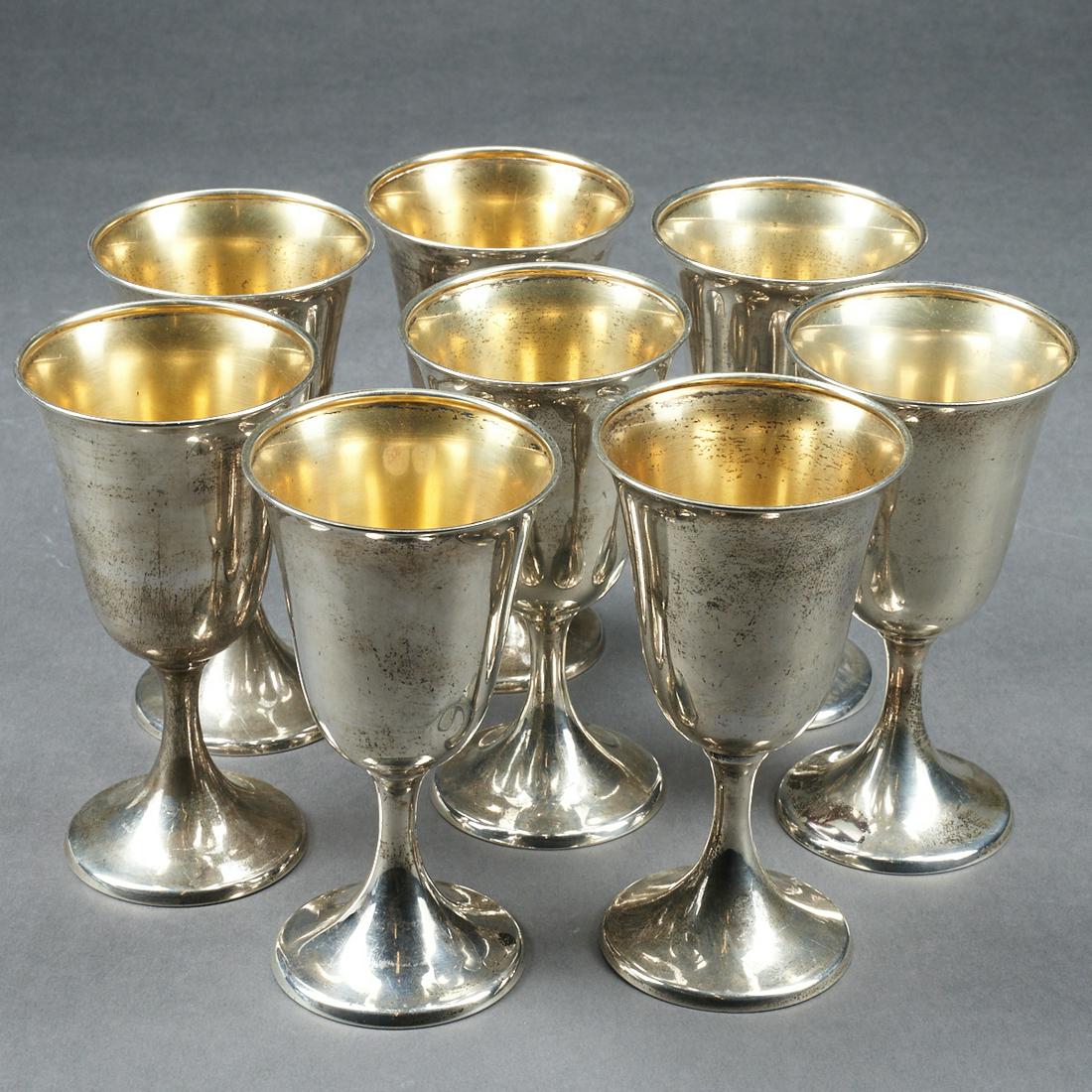 Grp: 8 International Sterling Silver Goblets: Group of eight International sterling silver goblets with gold wash interiors. Marked with the International Sterling mark along the underside. Height: 6 1/4 in x diameter: 3 3/8 in. Weight of set: 30