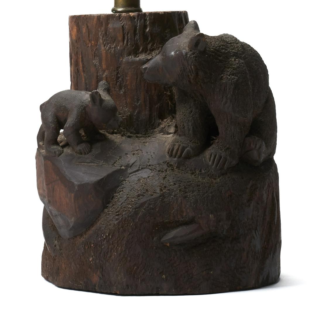 John Clarke Carved Wooden Bear Lamp Stand: John Louis (Cutapuis) Clarke (American (Blackfoot), 1881-1970). Carved wooden lamp stand depicting a mother bear and her cub. Signed along the reverse. Wood carving; height: 7 1/4 in x diameter: 6 5/8