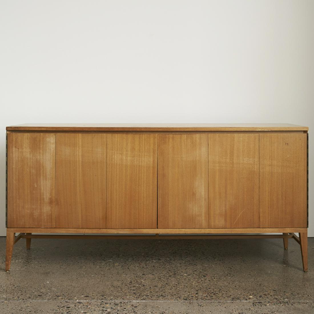 Paul McCobb Irwin Calvin Credenza Dresser: Paul McCobb (American, 1917-1969) for Calvin Furniture Co., Grand Rapids, Michigan. Irwin Collection large mid-century modern dresser or credenza with two bi-fold accordion doors that open to reveal m