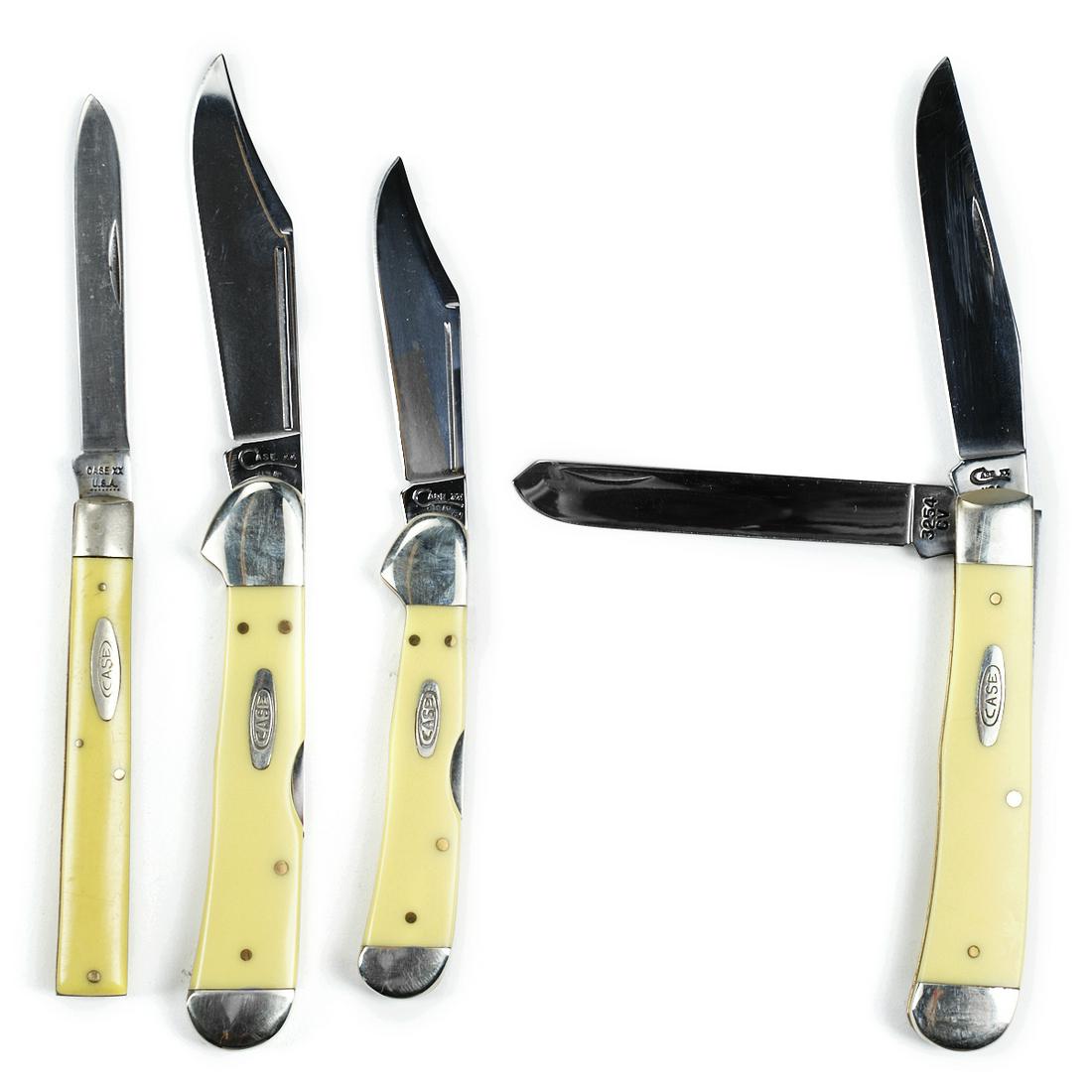 Grp: 4 Case Celluloid Bakelite Folding Knives: Group of four Case folding knives with handles in pale yellow celluloid or Bakelite.Height ranges from 3 3/4 in to 4 1/4 in; width ranges from 5/8 in to 1 in; depth ranges from 3/8 to 5/8 in.