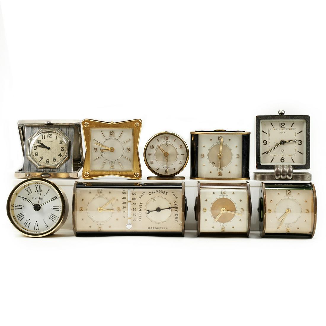 Grp: 9 Desk Table Travel Clocks - Waltham - Tiffany -: Group of nine desk, table, or travel clocks including one Elgin Waltham travel clock, one Portfolio desk clock by Tiffany & Co., six Le Coultre desk clocks, and one Le Coultre combination desk clock a