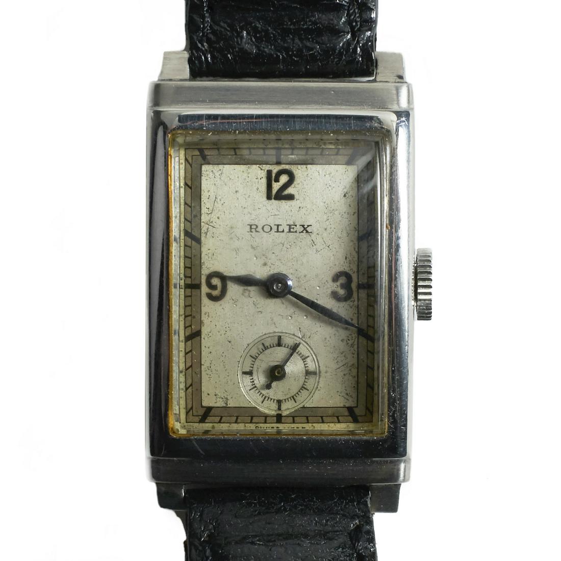 Vintage Rolex Rectangular Watch Ref. 1936 - 032790: Vintage Rolex watch with a rectangular dial. Stainless steel case. With a De Beer, Paris leather band. Reference number: 1936. Serial number: 032790.