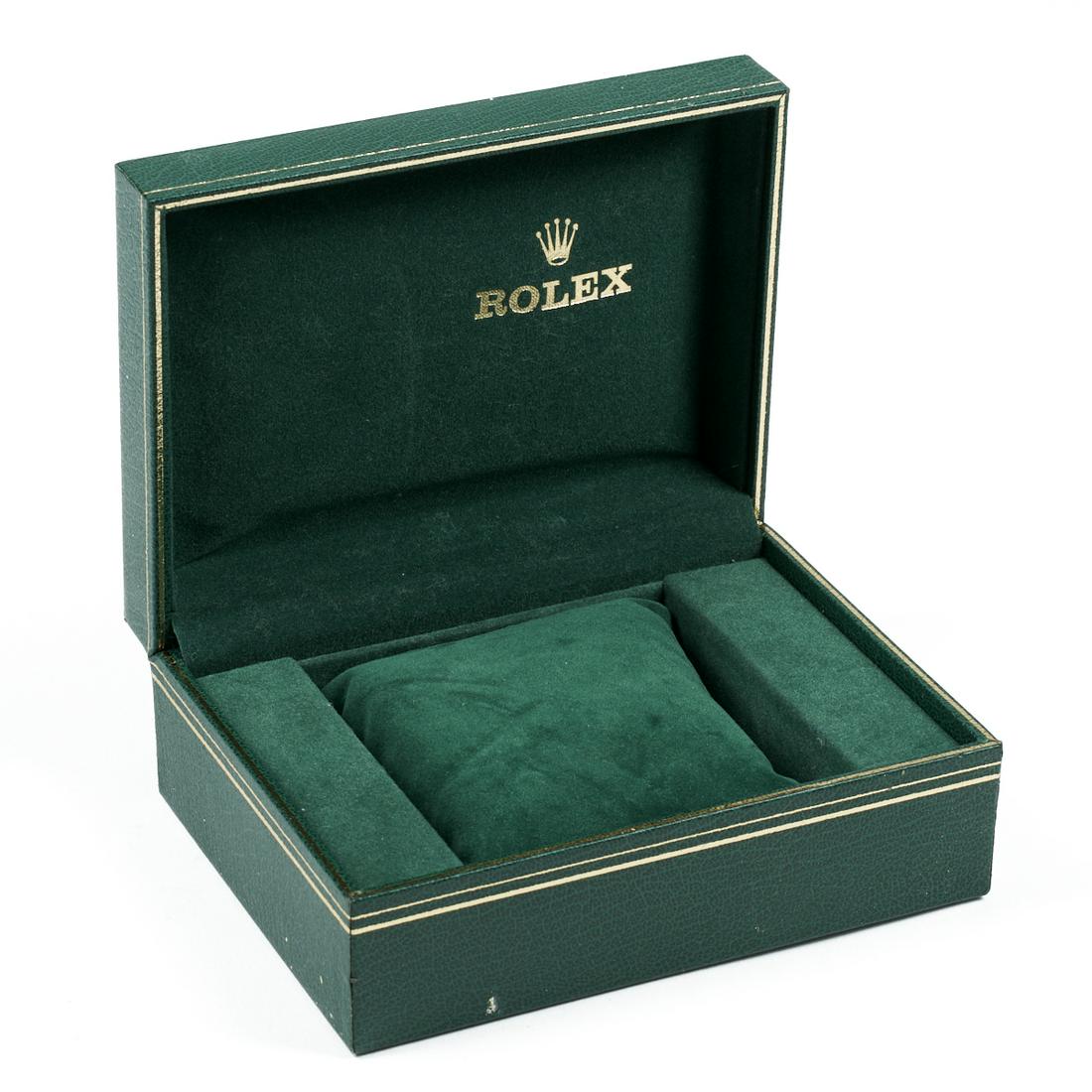 Vintage Rolex Watch Box: Vintage Rolex watch display box. Green leather exterior with the gilt Rolex logo along the lid; green suede interior with removable cushion and gilt Rolex logo along the interior lid. Height: 4 1/4 in