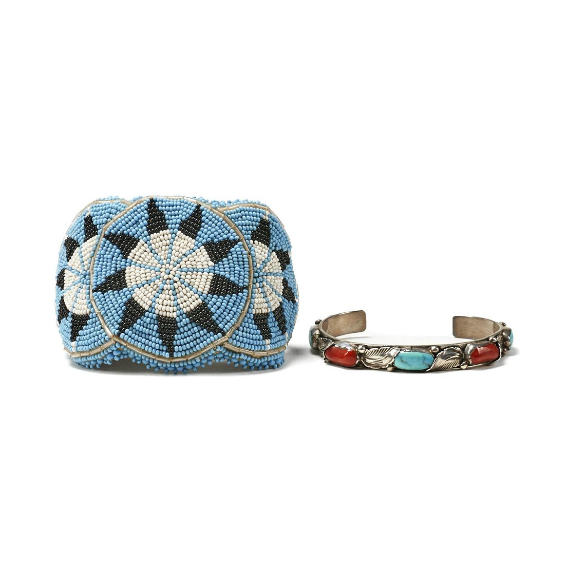 Grp: 2 Zuni Silver Cuffs - Simplicio & Beaded: Group of two Southwest Native American silver cuff bracelets including one Zuni silver cuff bracelet decorated with blue, black, and white beads in a geometric triple sun design; and one Carmelita Sim