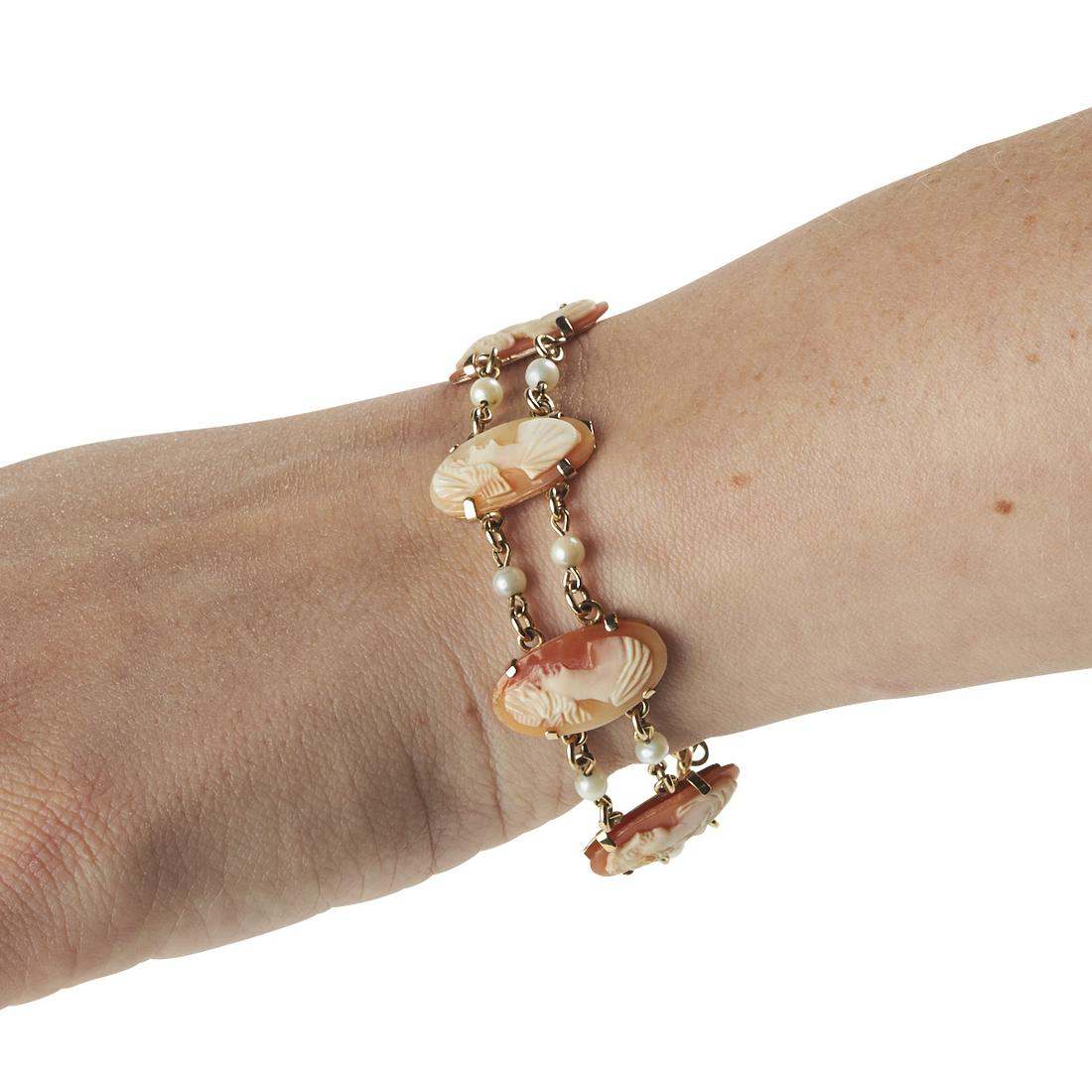14K Gold Cameo Pearl Bracelet: 14K yellow gold cameo pendant and pearl bracelet. Features six individual cameos depicting Greco-Roman female portraits, with 14K gold backing. Cameos are connected by 14K gold bracelet chains with pe