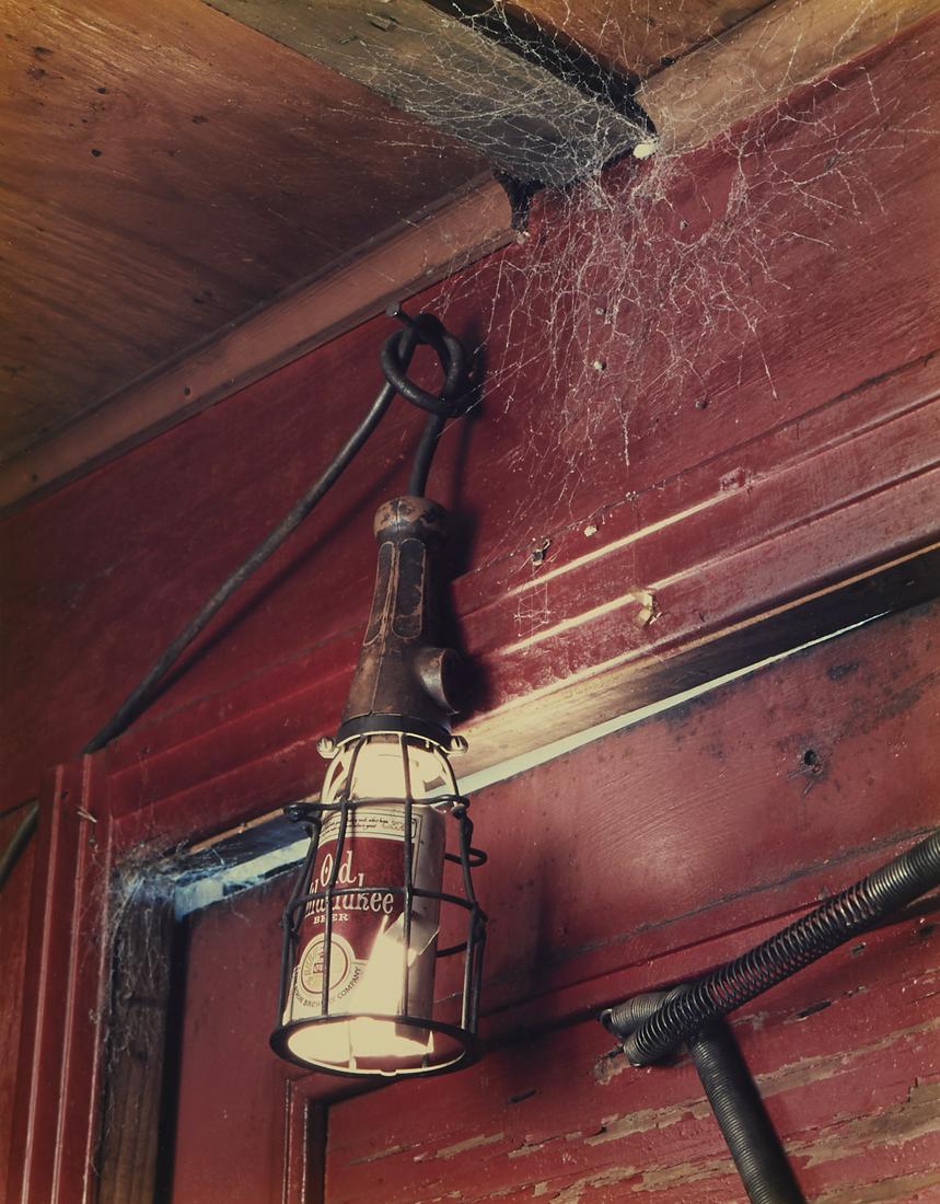 Birney Imes Photograph Old Milwaukee Beer Can: Birney Imes (American, b. 1951). Photograph depicting a cobweb covered light made from an Old Milwaukee beer can. Chromogenic print. Provenance: Distinguished corporate collection, Minnesota. Sight; h