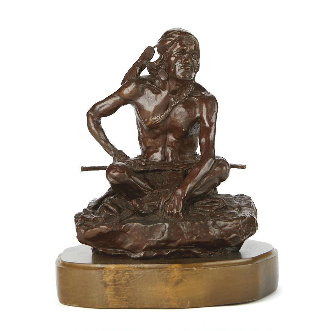 After CM Russell Native American Bronze Sculpture: After Charles Marion Russell (American, 1864-1926). 20th century cast bronze sculpture depicting a seated Native American man. He holds a rifle on his lap as he waits on guard. Affixed to a wooden bas
