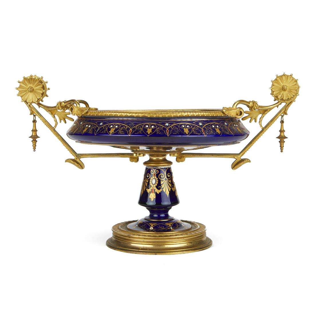 French Empire Ormolu & Enameled Tazza: French Empire ormolu and enameled tazza with an elaborate gilt scroll design throughout set against a cobalt blue ground, decorated with enamel floral accents, flanked by two scrolling gilt handles wi