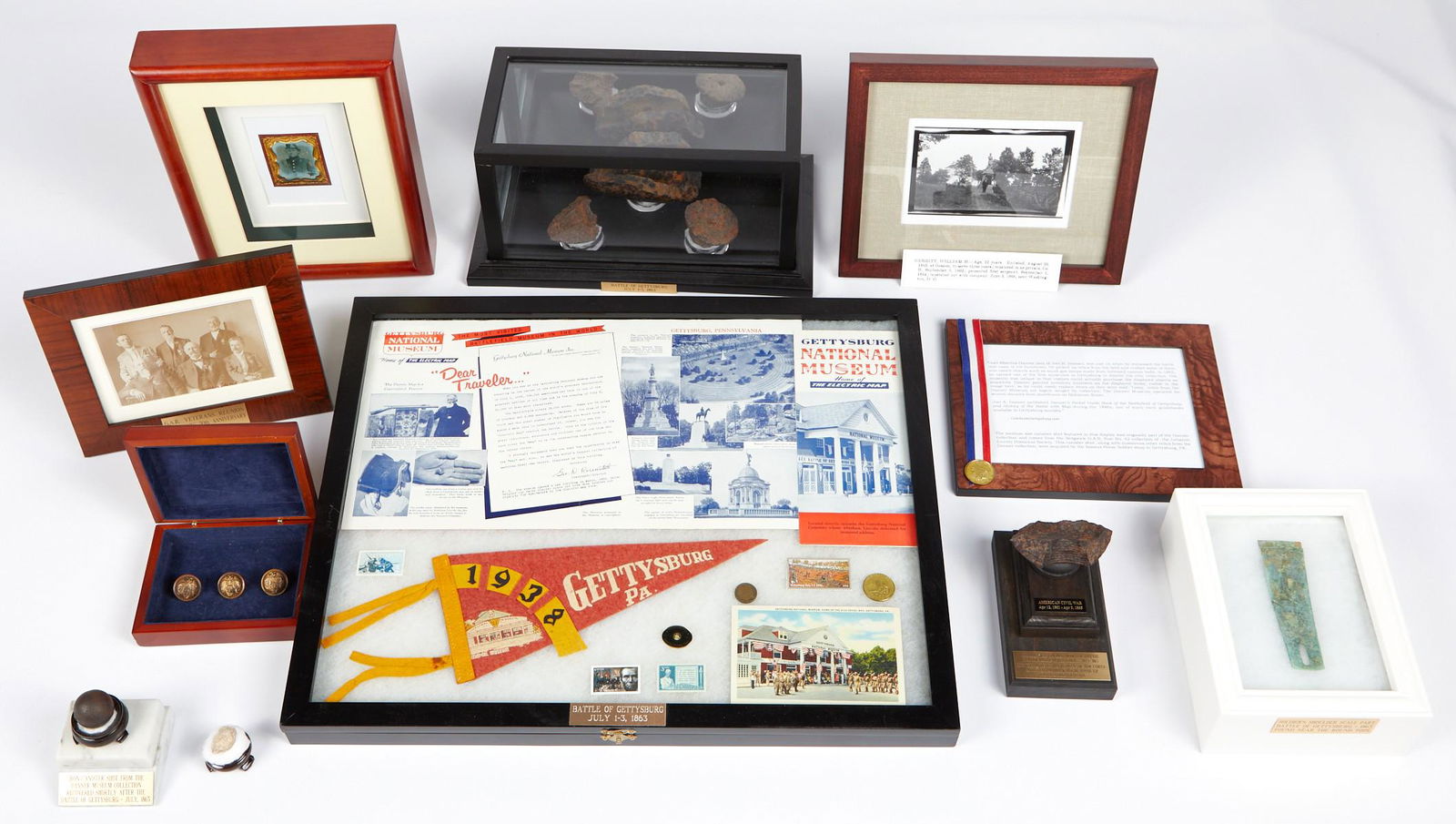 Large Group of Gettysburg Relics Ephemera Rosensteel: Large group of Gettysburg relics, ephemera, and artifacts. This group features:Large, cased display with three shell fragments from the Battle of Gettysburg. Height: 6 1/2 in x width: 14 in x depth: 8