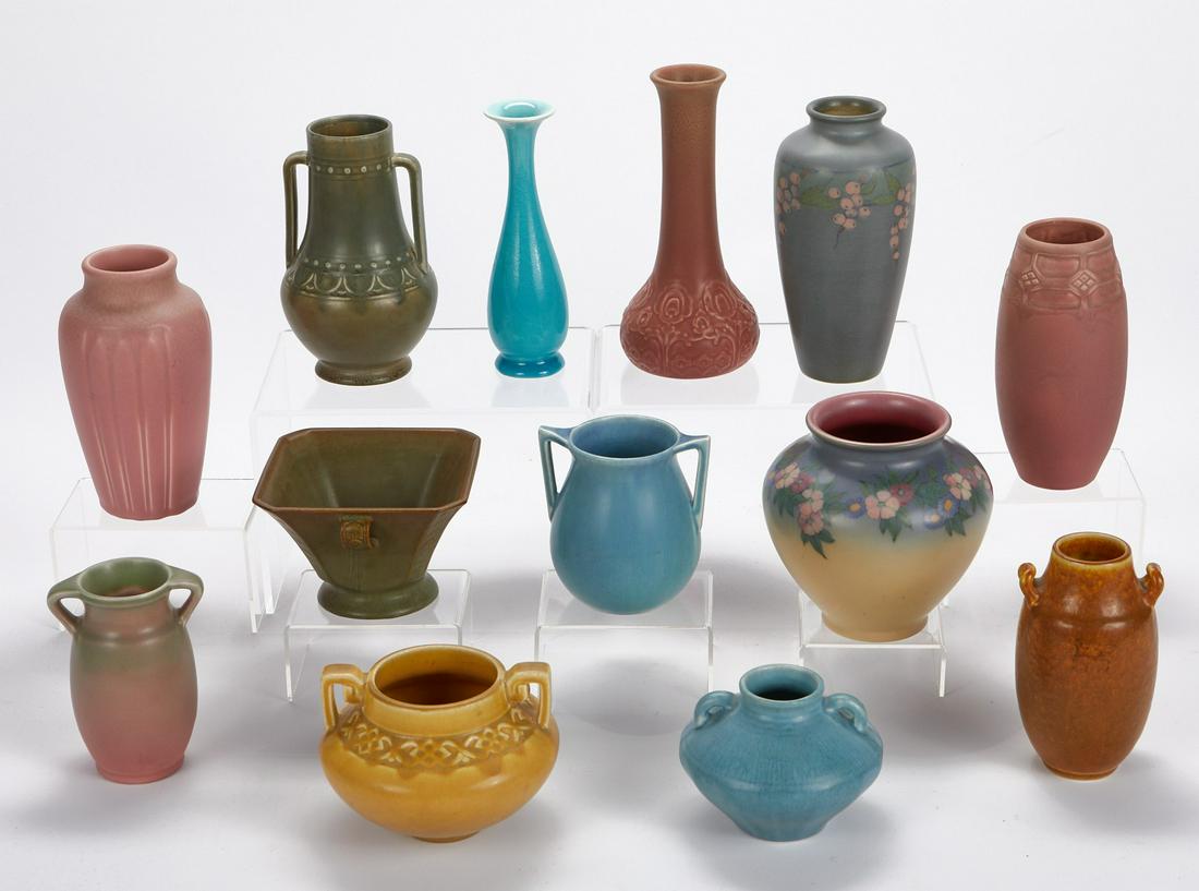 Grp: 13 1920s Rookwood Vases: Rookwood Pottery, Ohio, USA. Group of thirteen Arts & Crafts pottery pieces dating from 1920 to 1929.Includes one square vase impressed with the Rookwood mark, shape number 274 I, and dated "XXIX