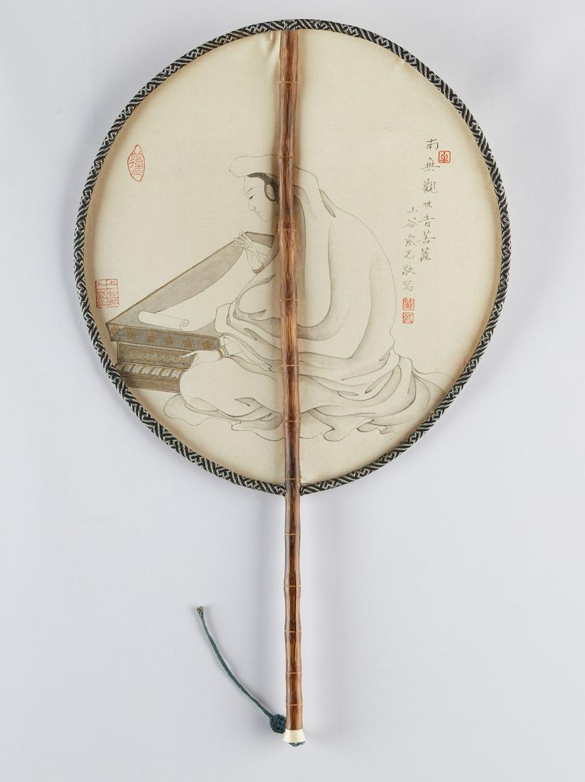 Zang Languang Chinese Fan Painting: Zang Languang (Chinese, 1912-1980). Fan painting on an oval fan depicting a figure seated at a writing desk, ink on silk. The reverse decorated with calligraphy. Length (including handle): 16 in x wid