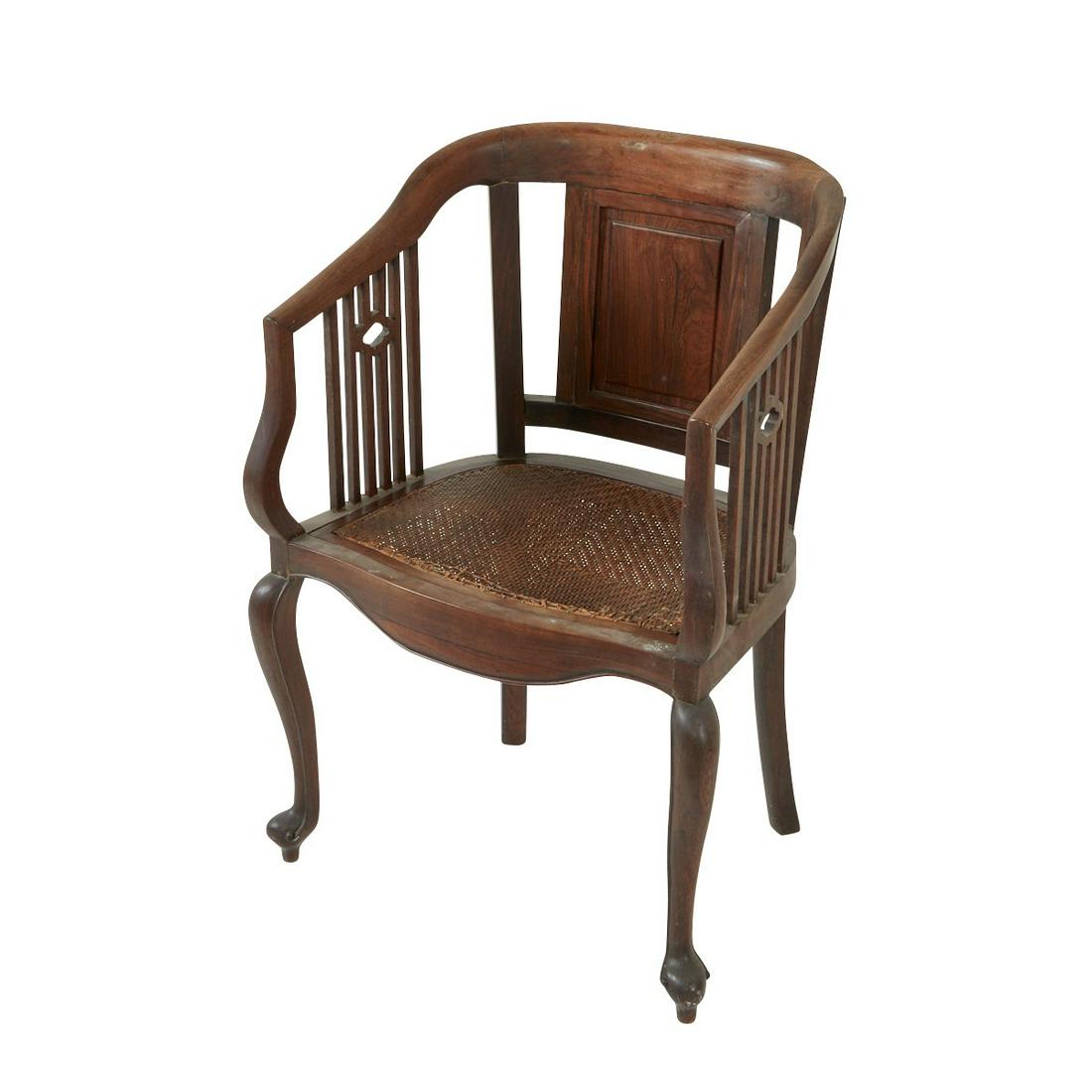 Chinese Export Rosewood Armchair w/ Woven Seat: Chinese Export English market rosewood armchair, with a woven seat and openwork carving under the arm supports. Height: 36 1/4 in x width: 26 in x depth: 18 3/4 in.