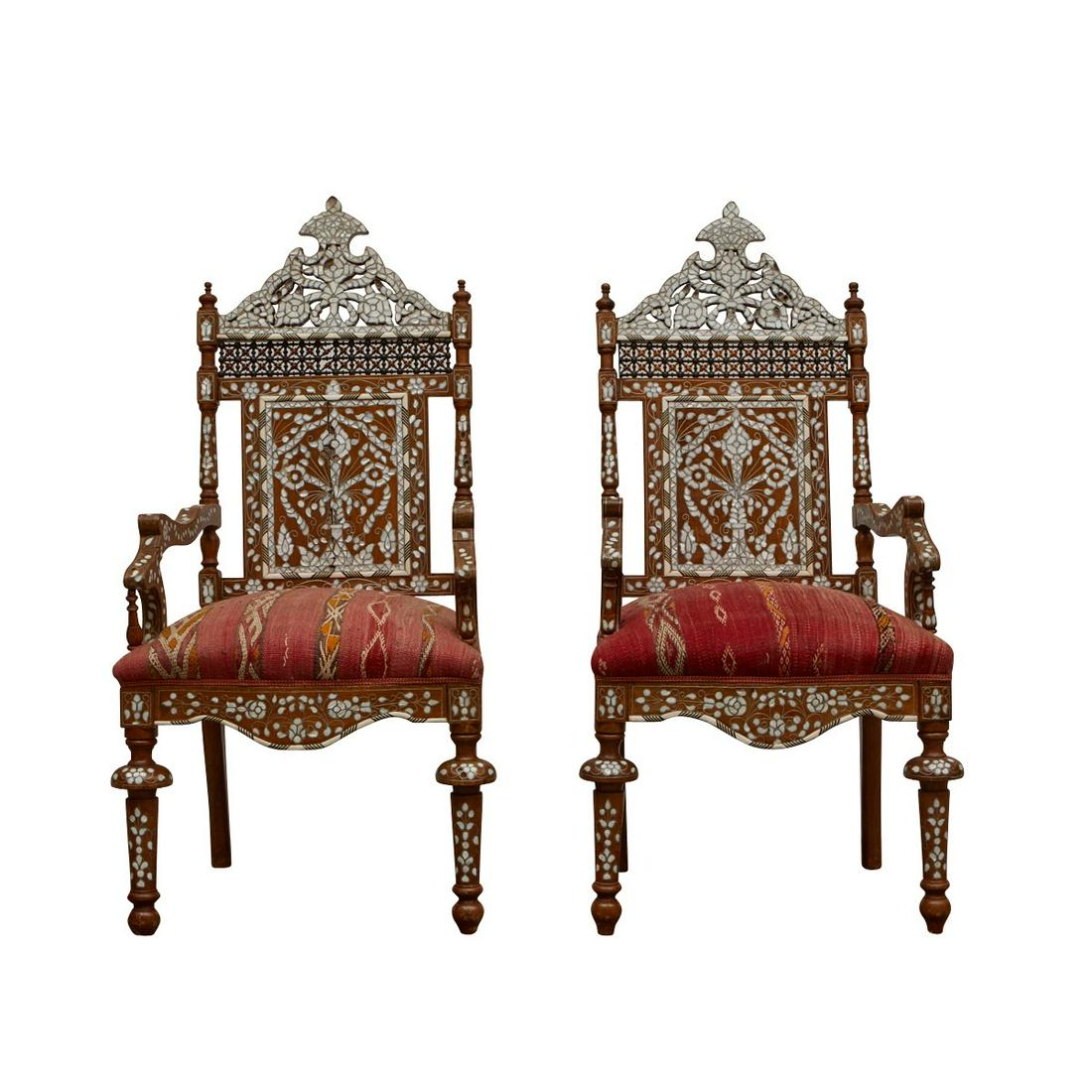 Pair of Syrian Mother of Pearl Inlaid Armchairs: Pair of Syrian mother of pearl inlaid wooden armchairs. Richly decorated with floral motifs in mother of pearl utilizing the intarsia method. With matching upholstered seats. Keywords: Levantine, Pers