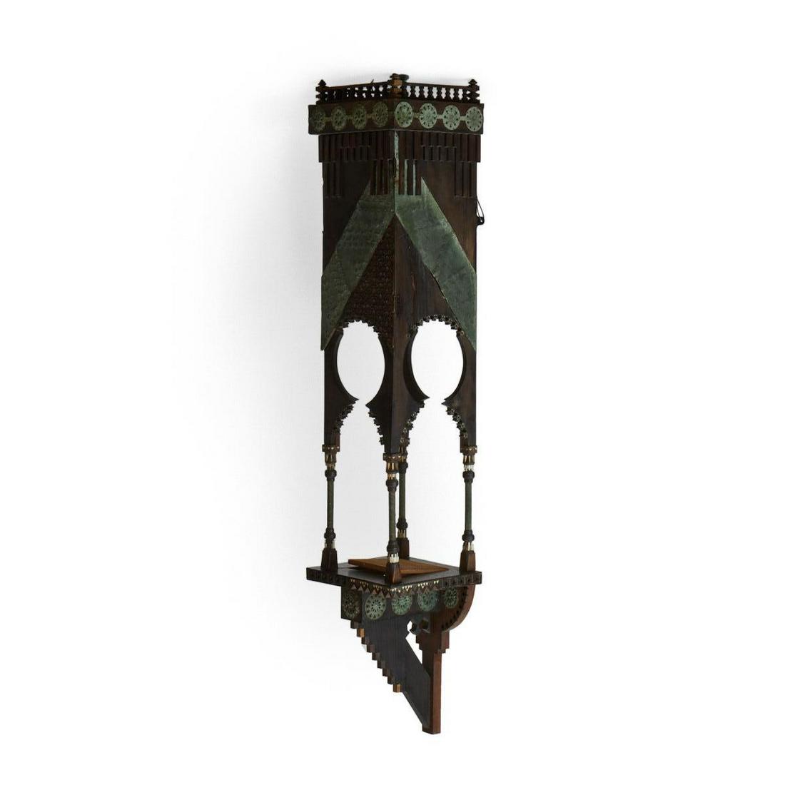 Carlo Bugatti Hanging Wall Cabinet: Carlo Bugatti (Italian,1856-1940). Orientalist ebonized wood hanging wall cabinet with elaborate inlaid decoration. The lower shelf rests on a stepped support and is flanked by four graceful columns w