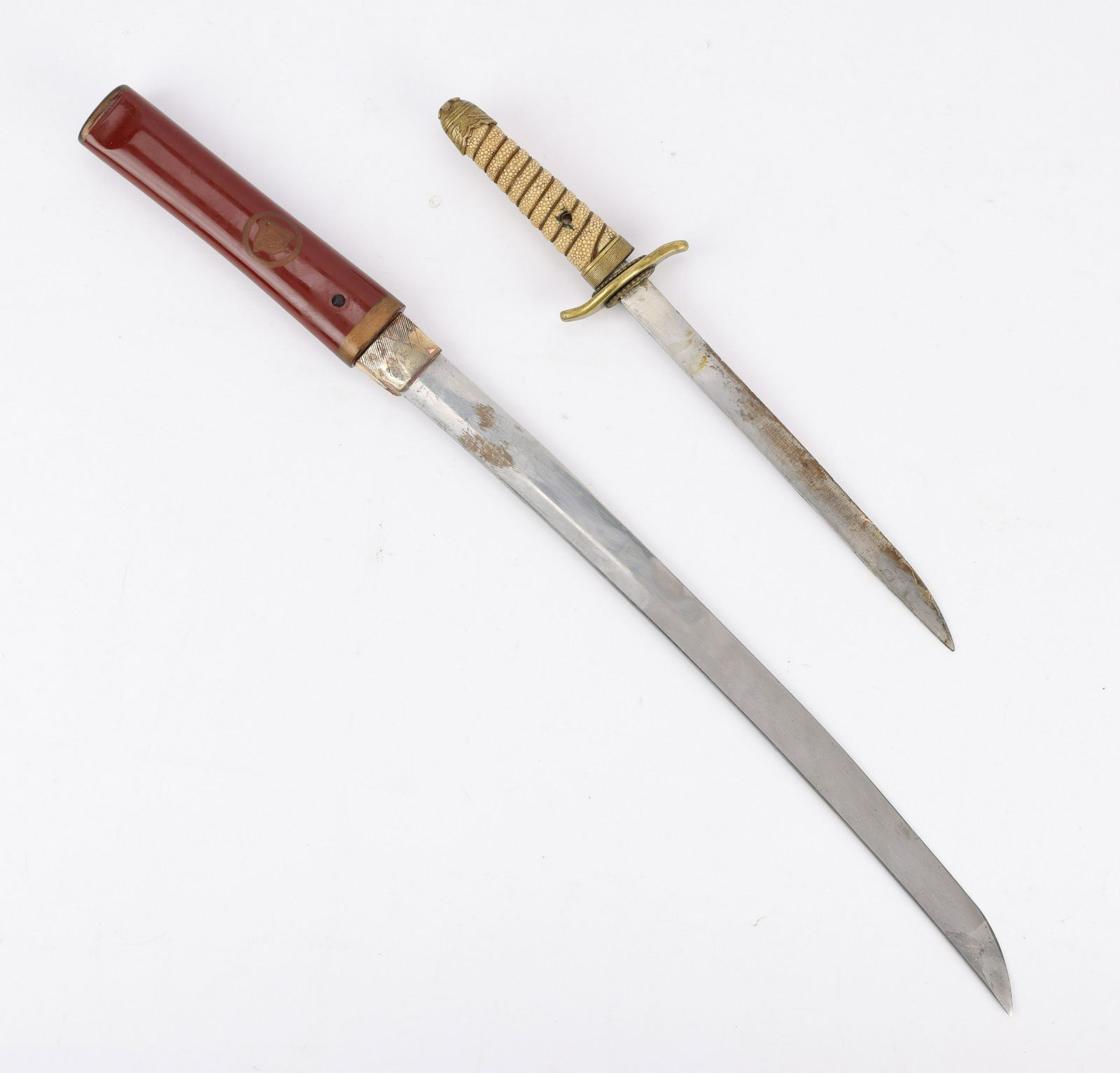2 Japanese WWII Blades swords: Two World War II era Japanese blades including:One WW2 Japanese naval dirk. With one rivet and bolster missing and a possible later blade.One 1944-45 Japanese type 98 shin gunto.Provenance: From the E