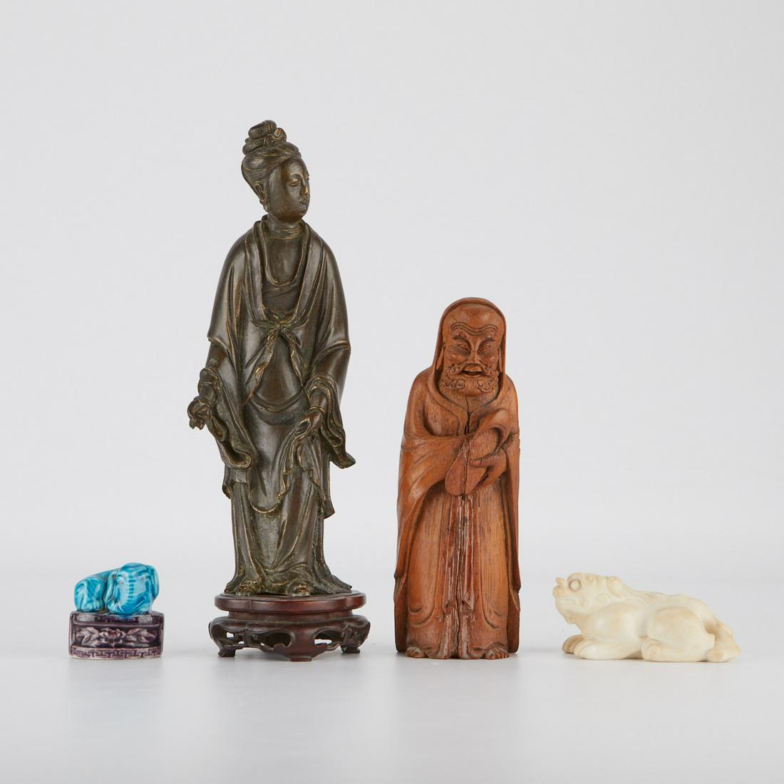 4 Chinese Items - Bronze, Porcelain, Bamboo, Jade: A lovely collection of Chinese antiques, including a small porcelain elephant from the early 20th century, a 19th-century bronze of a court figure, an early 20th-century bamboo carving of an immortal,