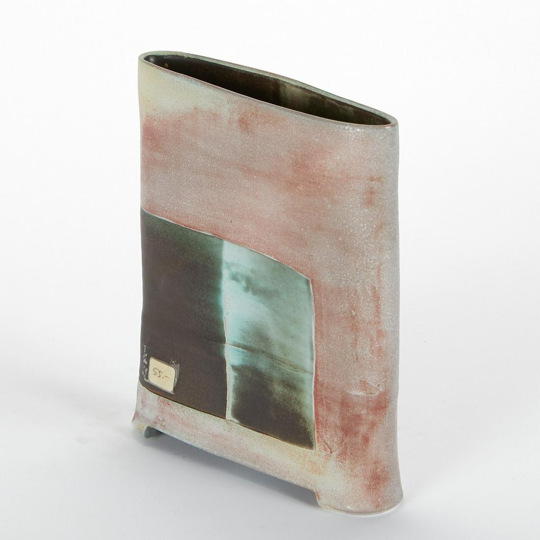 Maren Kloppmann Studio Pottery Vase: Maren Kloppmann (German, b. 1962). Footed oval ceramic vase in an orange glaze and green accent along the two sides. Marked along the footrim.Height: 7 3/4 in x width: 6 1/2 in x depth: 1 3/4 in.