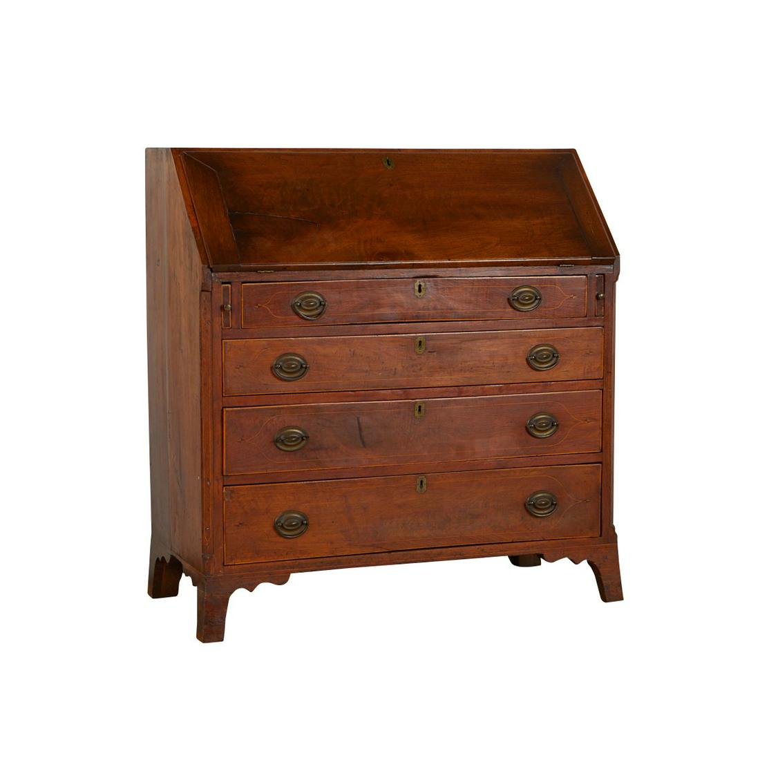 Federal Slant Front Desk w/ Inlay: Federal slant front secretary or writing desk with eight drawers and pigeon holes enclosed by slant front writing board, and four graduated drawers beneath. Accented by brass hinges. With ogree bracke