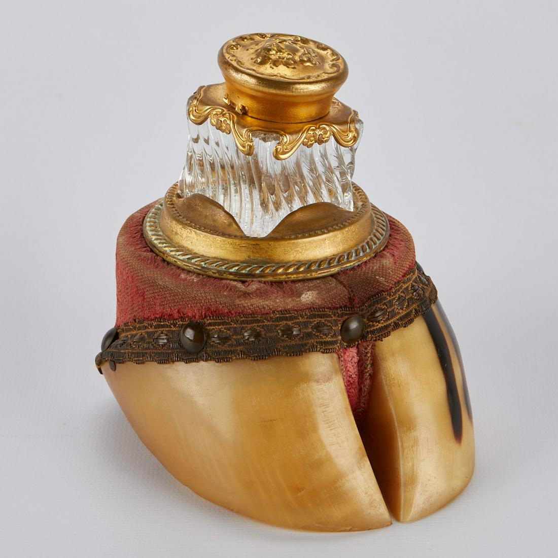 Victorian Bovine Hoof Inkwell: Victorian bovine hoof inkwell. The inset glass inkwell and hoof are mounted with gilt metal. Height: 4 1/2 in x width: 5 in x depth: 3 3/4 in.
