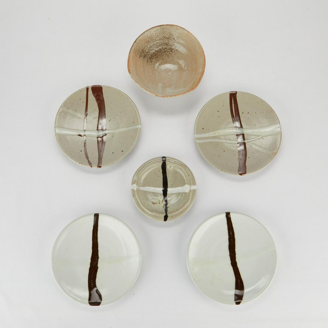 6 Randy Johnston Studio Pottery Dishes: Randy Johnston (American, 20th/21st c). Group of six studio pottery ceramics including five dishes and one bowl. The dishes with a streak of brown glaze. Five marked along the footrim.Height ranges fr