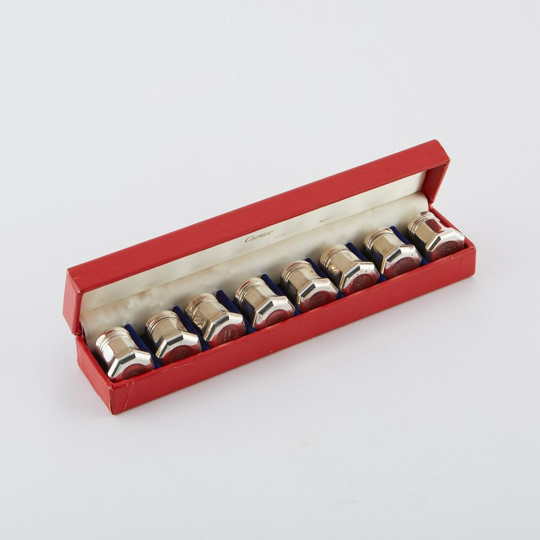 8 Cartier Sterling Silver Salt & Pepper Shakers: Cartier, France. Set of eight miniature sterling silver salt and pepper shakers housed in an original custom case. Each marked "Cartier Sterling" along the underside. Each; height: 1 3/8 in 